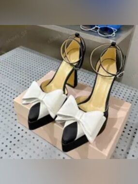 Women's White Block Heel Ankle Strap Sandals. Satin black bow embellishment